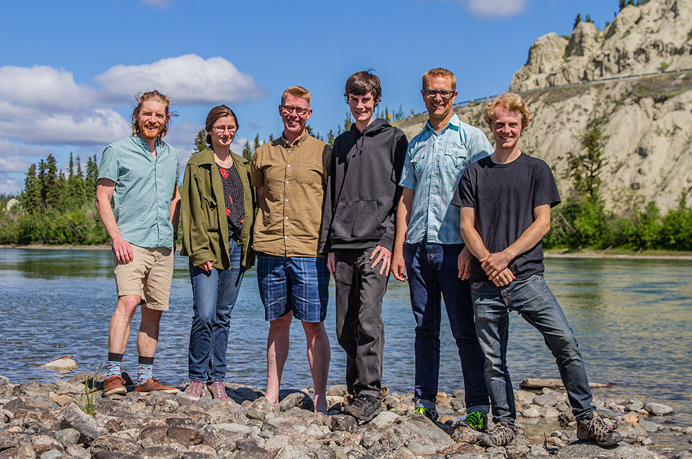 Team on the Yukon River shoreline